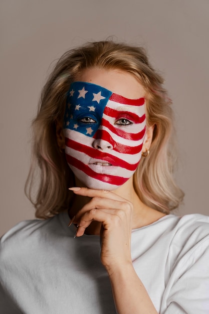 Front view woman posing with usa makeup