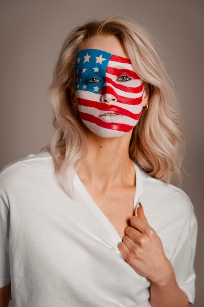 Front view woman posing with usa makeup