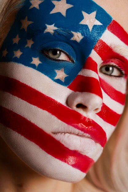 Front view woman posing with usa makeup