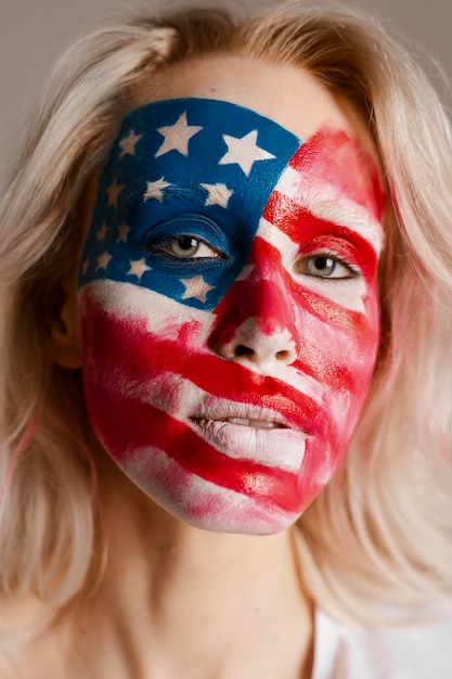 Front view woman posing with usa makeup