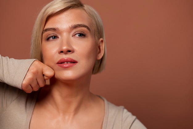 Free photo front view woman practicing facial yoga