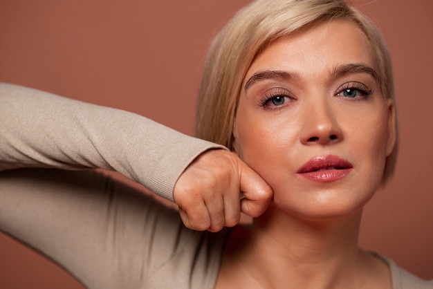 Free photo front view woman practicing facial yoga