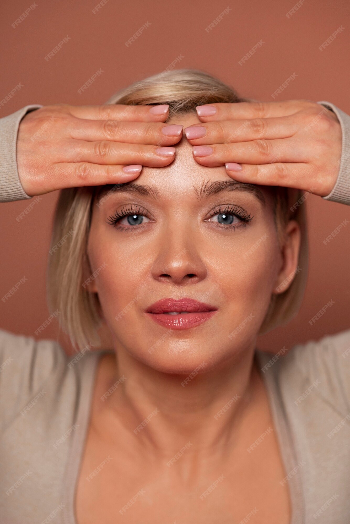 Free Photo Front view woman practicing facial yoga