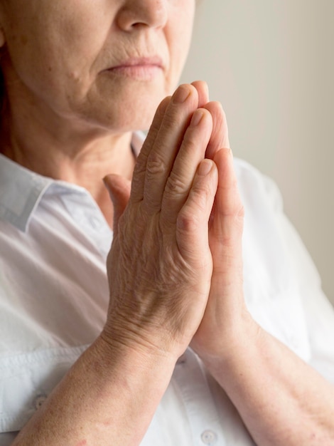 Front view of woman praying