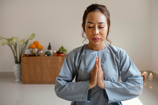 Front view of woman praying