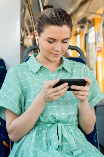 Free photo front view of woman in public transportation