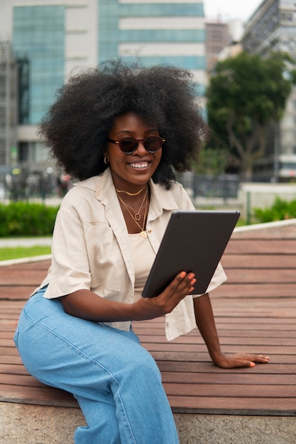 Free photo front view woman reading on tablet