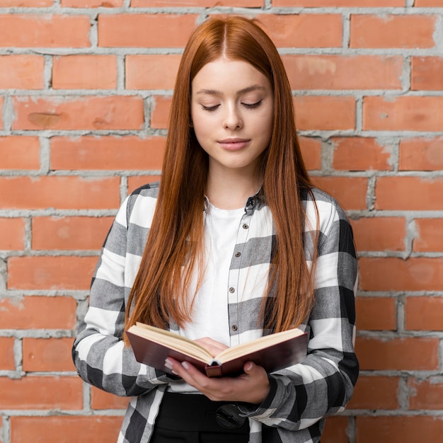 Free photo front view of woman reading