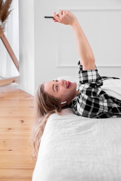 Free photo front view of woman relaxing at home