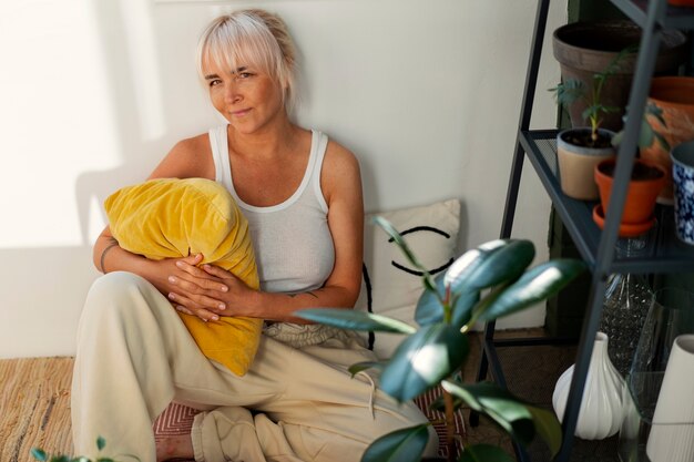 front view woman relaxing at home