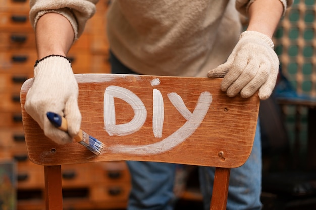 Free photo front view woman restoring wooden furniture