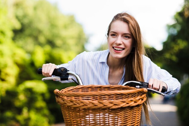 Front view woman riding a bicycle