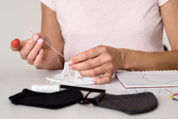 Front view of woman sewing