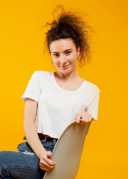 Free photo front view of woman sitting on chair