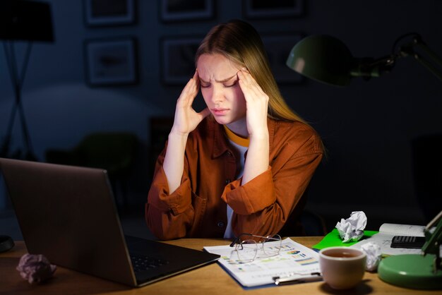 Front view of woman sitting at desk