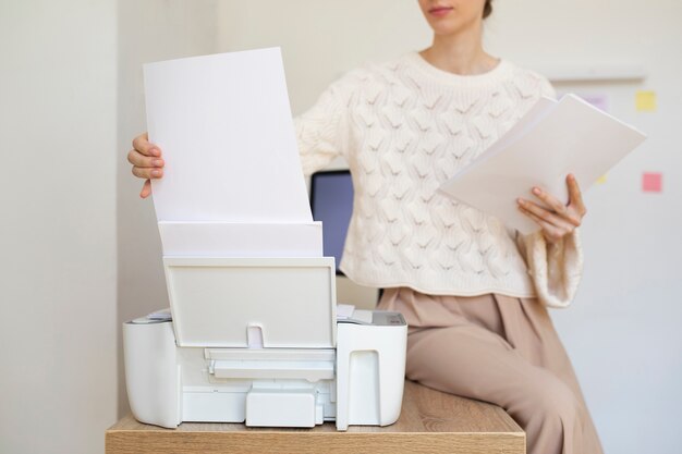 front view woman sitting on desk