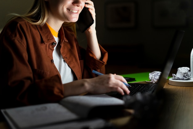 Free photo front view of woman talking at phone