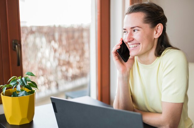 Front view of woman talking at phone