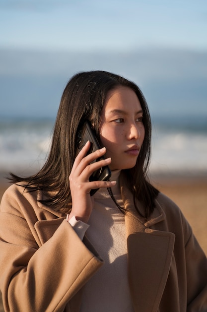 Front view woman talking on phone