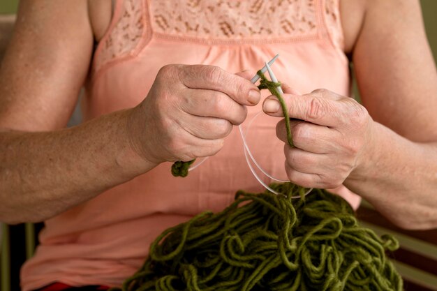 Front view of woman using crochet