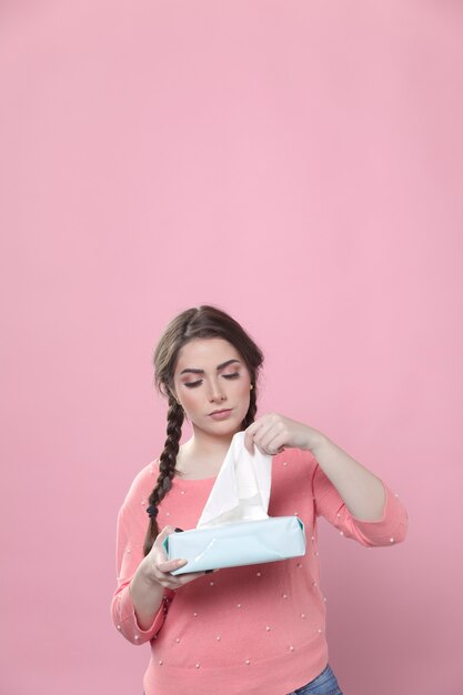 Front view of woman using napkins