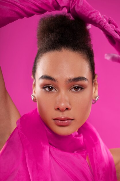 Free photo front view woman wearing full pink outfit