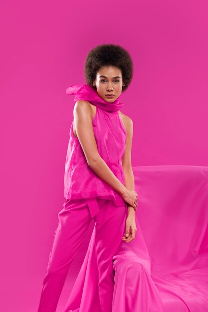 Free photo front view woman wearing full pink outfit