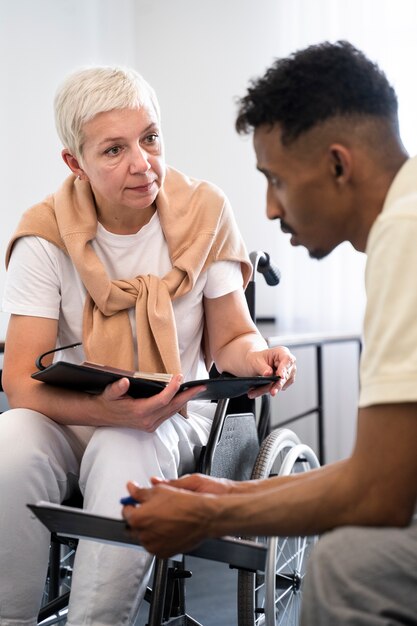 Front view woman in wheelchair at work