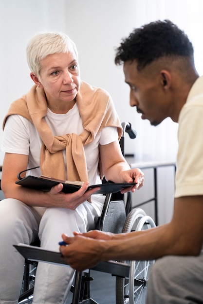 Front view woman in wheelchair at work