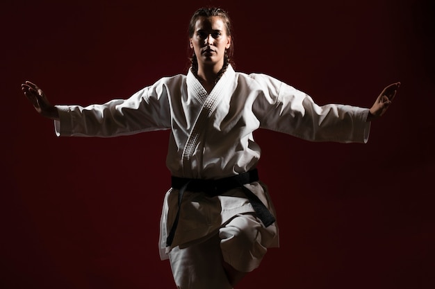 Front view woman in white karate uniform