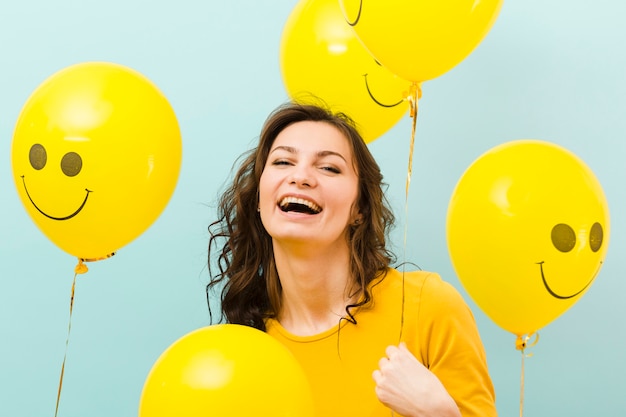 Front view of woman with balloons
