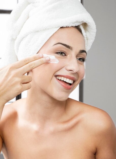 Front view of woman with beauty product concept