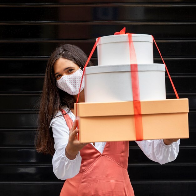 Front view of woman with boxes