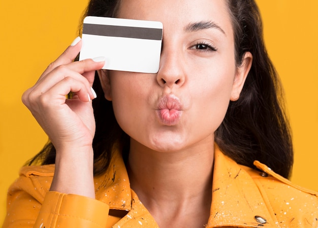 Front view of woman with credit card Premium Photo