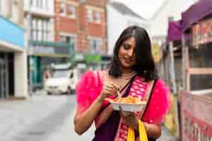 Free photo front view woman with delicious food