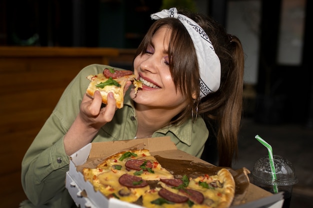 Front view woman with delicious pizza