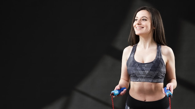 Front view of woman with dumbbells