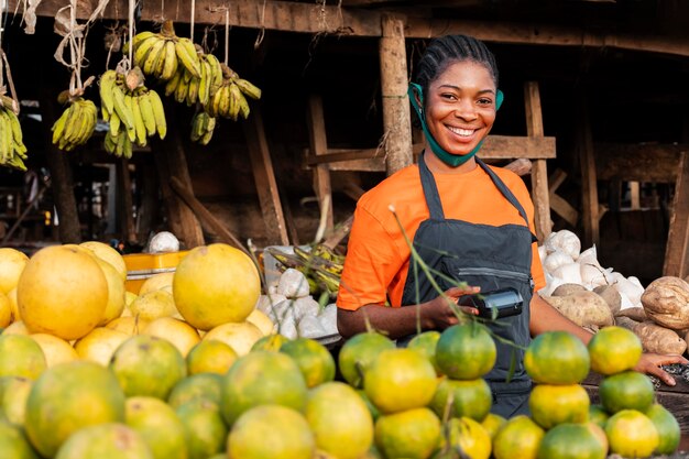 Front view of woman with face mask in market