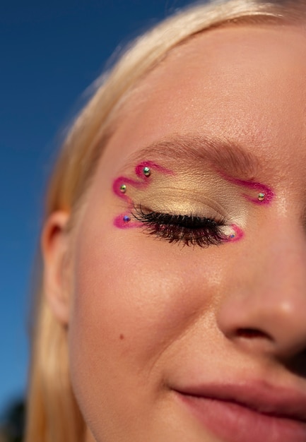 Front view woman with  graphic eye makeup