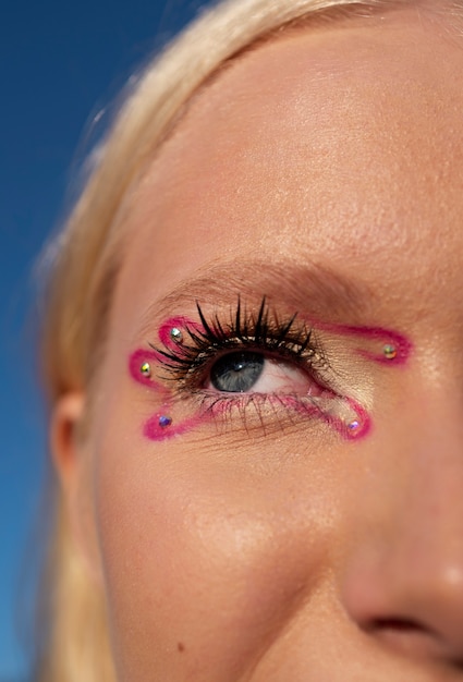 Front view woman with  graphic eye makeup