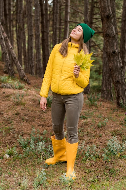 Front view woman with green beanie looking up