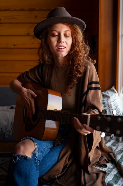 front view woman with guitar