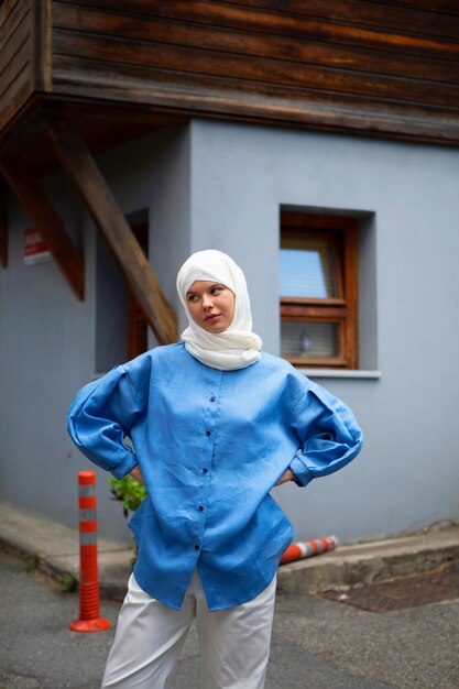 Front view woman with hijab outdoors