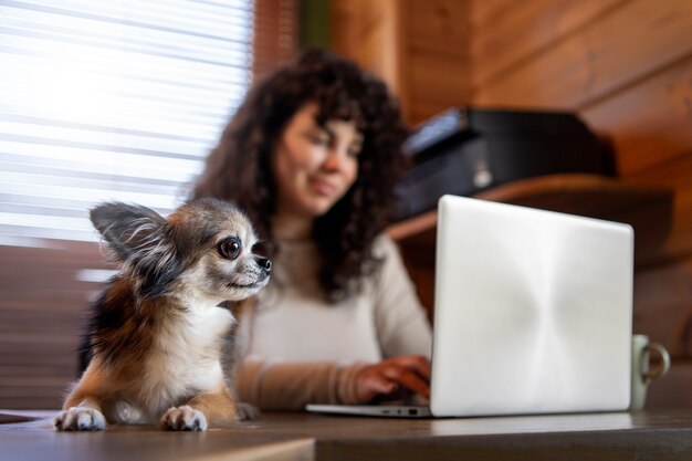 Front view woman with laptop at home