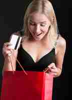 Free photo front view of woman with shopping bag concept