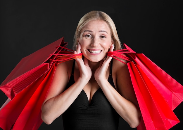 Free photo front view of woman with shopping bag concept