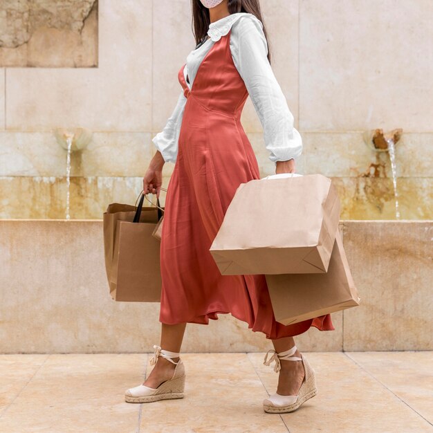 Front view of woman with shopping bags