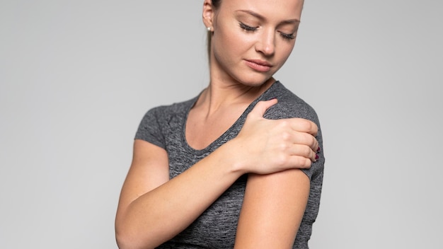 Front view of woman with shoulder pain