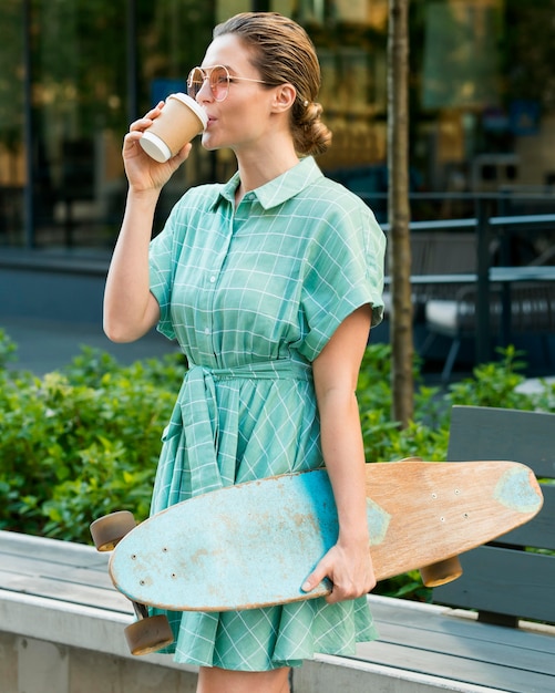 Free photo front view of woman with skateboard