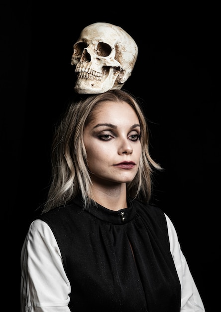 Free photo front view of woman with skull on head